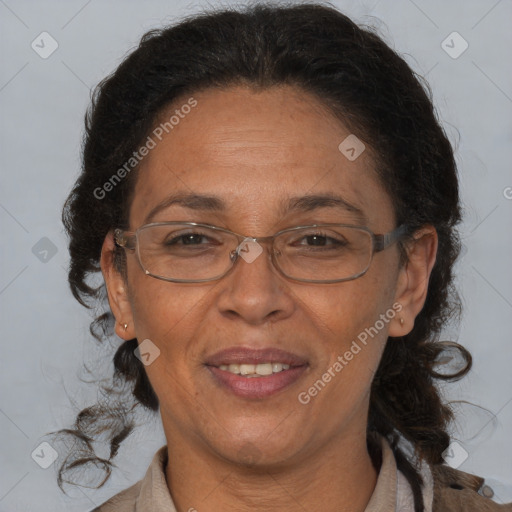 Joyful black adult female with medium  brown hair and brown eyes