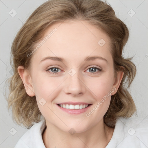 Joyful white young-adult female with medium  brown hair and blue eyes