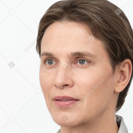 Joyful white adult female with short  brown hair and grey eyes