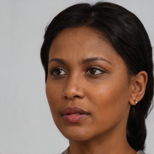 Neutral black young-adult female with long  black hair and brown eyes