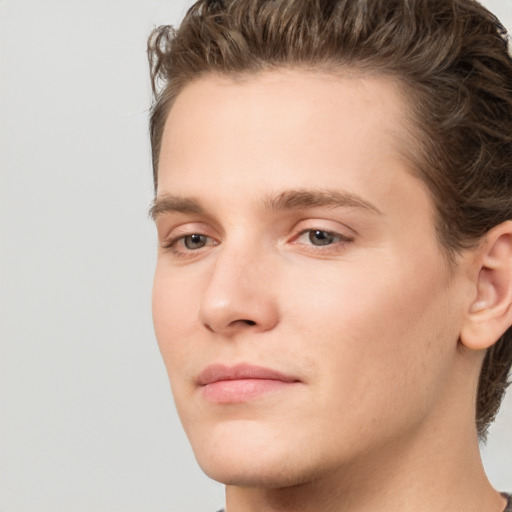 Joyful white young-adult male with medium  brown hair and brown eyes