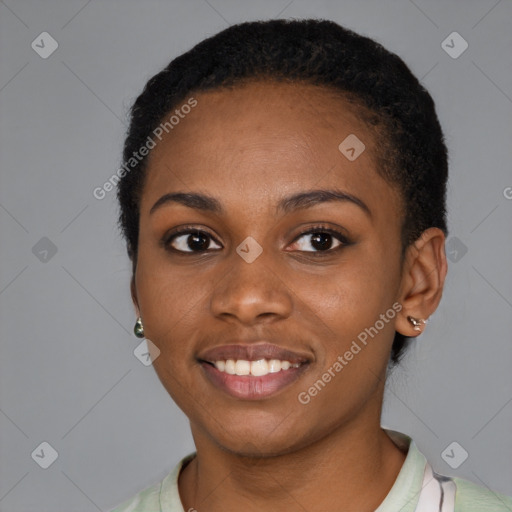 Joyful black young-adult female with short  black hair and brown eyes