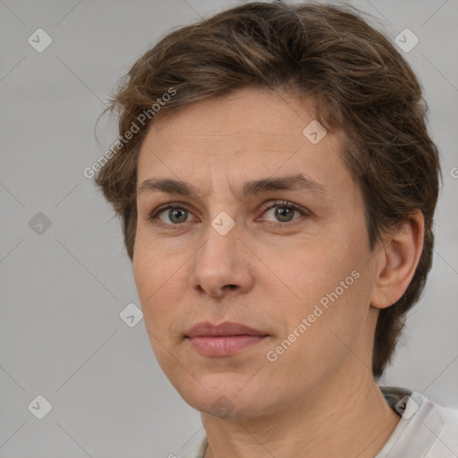 Joyful white adult female with short  brown hair and brown eyes