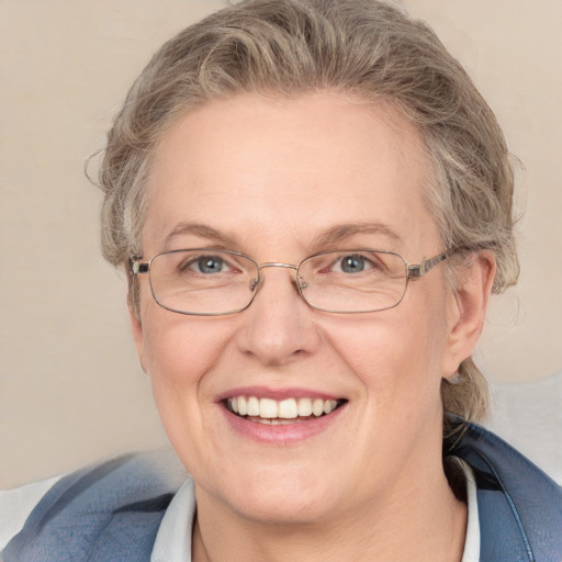 Joyful white middle-aged female with medium  brown hair and blue eyes