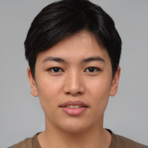 Joyful asian young-adult female with short  black hair and brown eyes