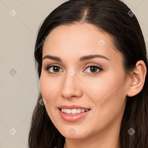 Joyful white young-adult female with long  brown hair and brown eyes