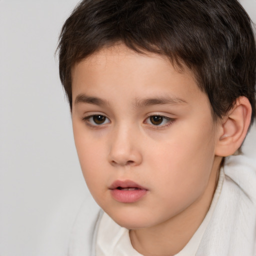 Neutral white child male with short  brown hair and brown eyes