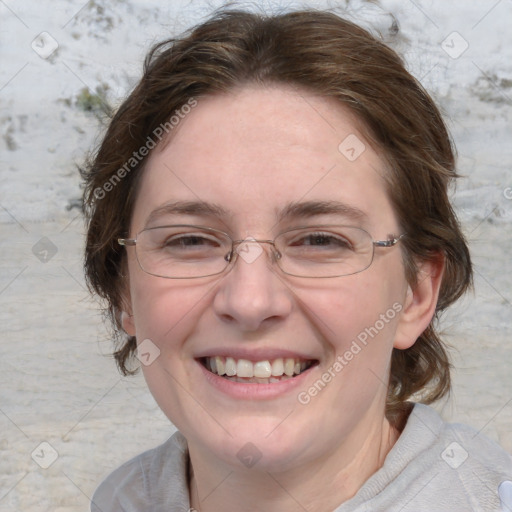 Joyful white adult female with medium  brown hair and blue eyes