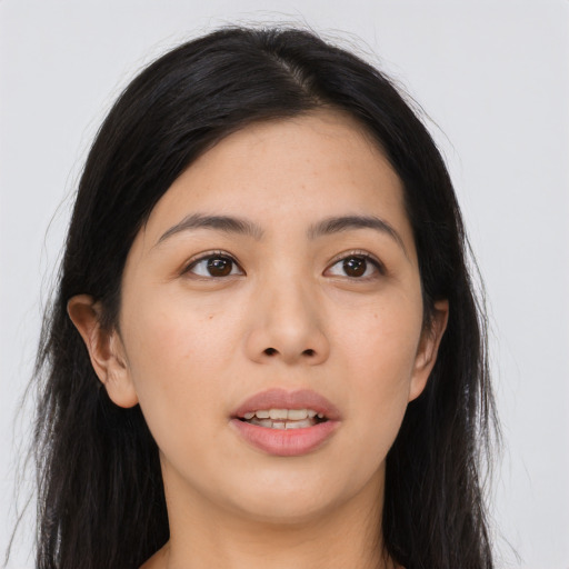 Joyful asian young-adult female with long  black hair and brown eyes