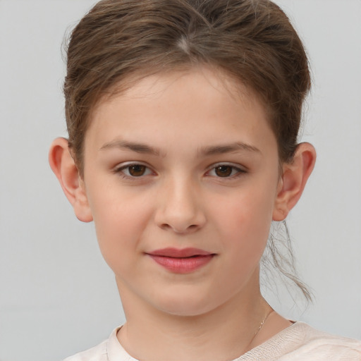 Joyful white child female with short  brown hair and brown eyes