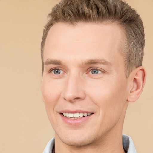 Joyful white adult male with short  brown hair and brown eyes