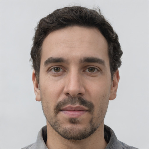 Neutral white young-adult male with short  black hair and brown eyes