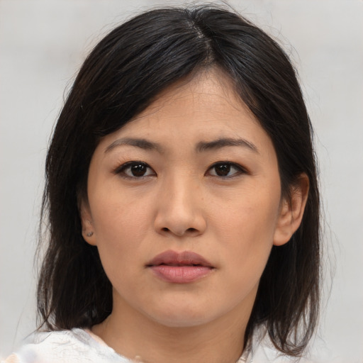 Neutral asian young-adult female with medium  brown hair and brown eyes