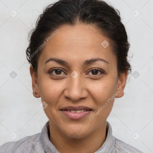 Joyful latino adult female with short  brown hair and brown eyes