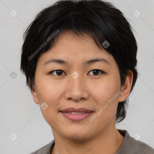 Joyful asian young-adult female with short  brown hair and brown eyes