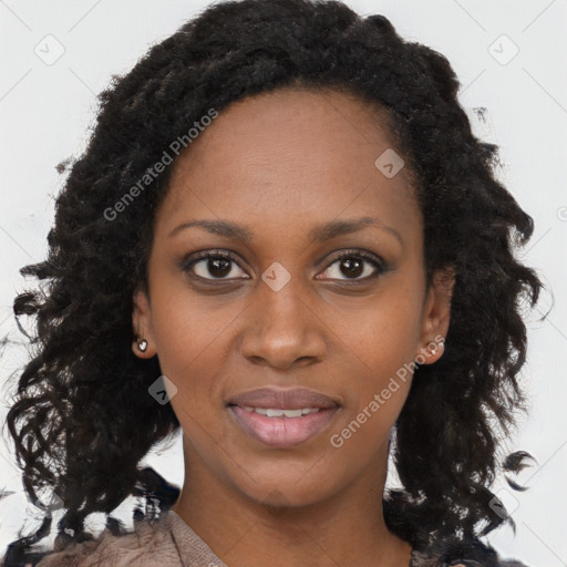 Joyful black young-adult female with long  brown hair and brown eyes