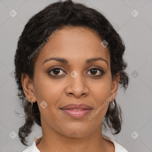 Joyful latino adult female with medium  brown hair and brown eyes