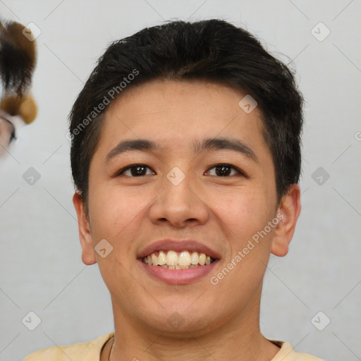 Joyful asian young-adult male with short  brown hair and brown eyes