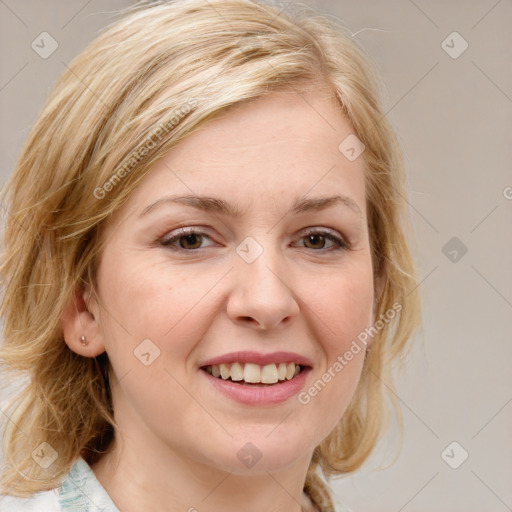 Joyful white young-adult female with medium  brown hair and blue eyes