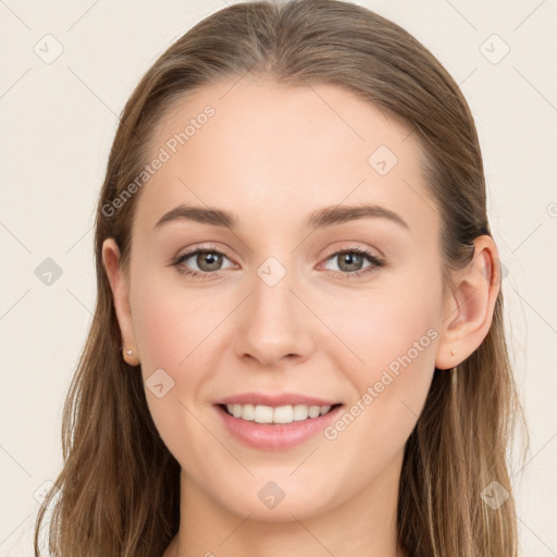 Joyful white young-adult female with long  brown hair and blue eyes