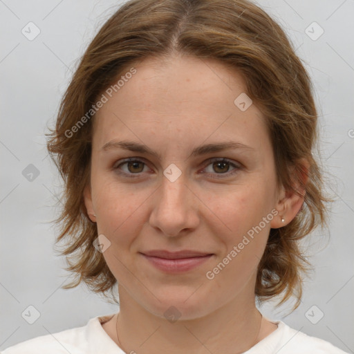 Joyful white young-adult female with medium  brown hair and green eyes