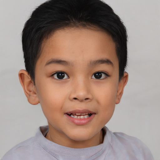 Joyful latino child female with short  brown hair and brown eyes