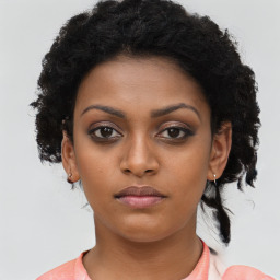 Neutral black young-adult female with short  black hair and brown eyes