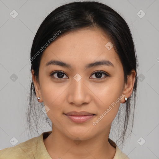 Joyful latino young-adult female with medium  brown hair and brown eyes