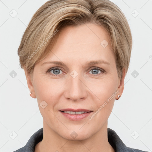 Joyful white adult female with short  brown hair and grey eyes