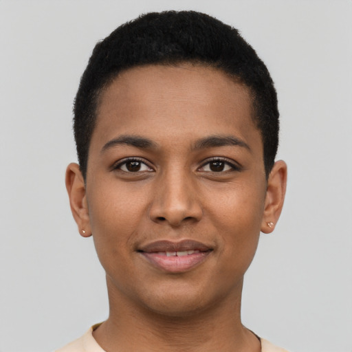 Joyful latino young-adult male with short  brown hair and brown eyes