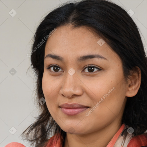 Joyful asian young-adult female with long  brown hair and brown eyes