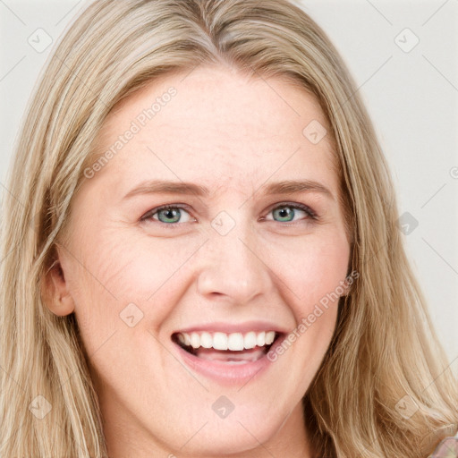 Joyful white young-adult female with long  brown hair and blue eyes