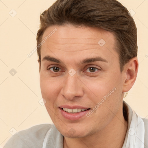 Joyful white adult male with short  brown hair and brown eyes