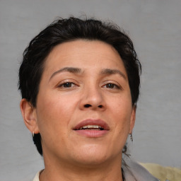 Joyful white adult female with short  brown hair and brown eyes
