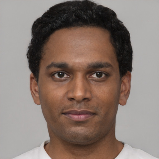 Neutral black young-adult male with short  black hair and brown eyes