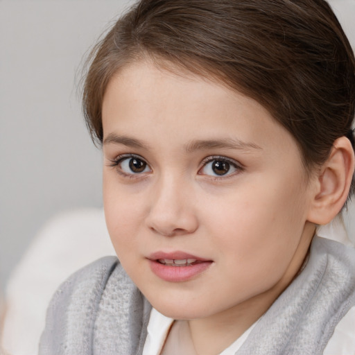 Joyful white child female with short  brown hair and brown eyes