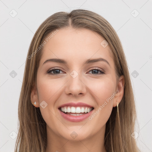 Joyful white young-adult female with long  brown hair and grey eyes