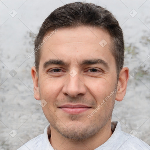 Joyful white adult male with short  brown hair and brown eyes