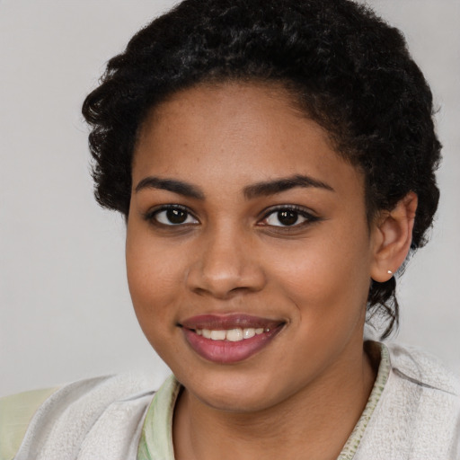 Joyful latino young-adult female with short  brown hair and brown eyes