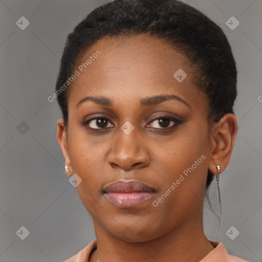 Joyful black young-adult female with short  brown hair and brown eyes