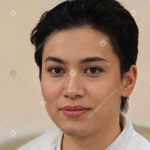 Joyful latino young-adult female with short  brown hair and brown eyes