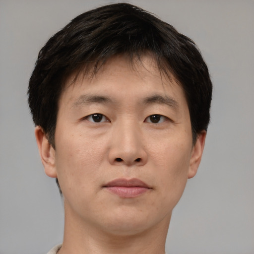 Neutral asian young-adult male with short  brown hair and brown eyes