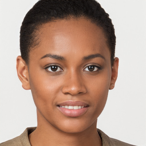 Joyful black young-adult female with short  brown hair and brown eyes