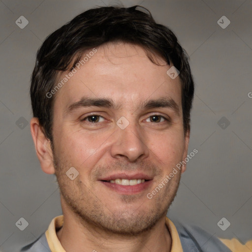 Joyful white adult male with short  brown hair and brown eyes