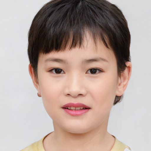Joyful white child female with short  brown hair and brown eyes