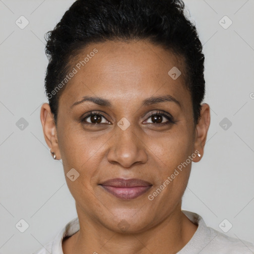 Joyful black adult female with short  brown hair and brown eyes