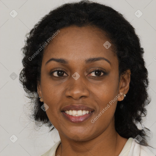 Joyful black young-adult female with medium  black hair and brown eyes