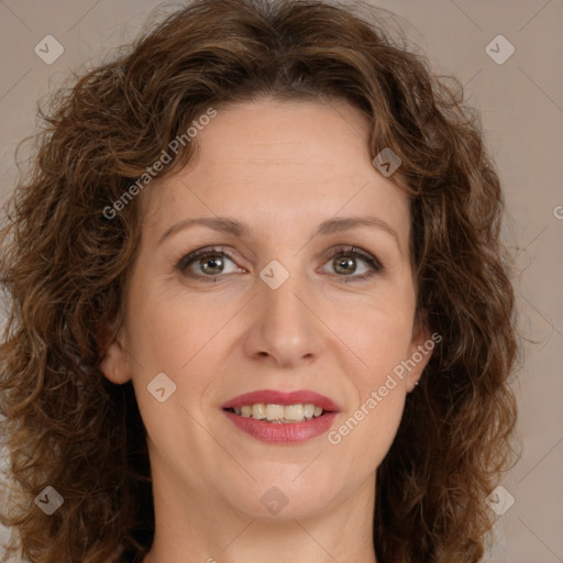 Joyful white adult female with long  brown hair and brown eyes