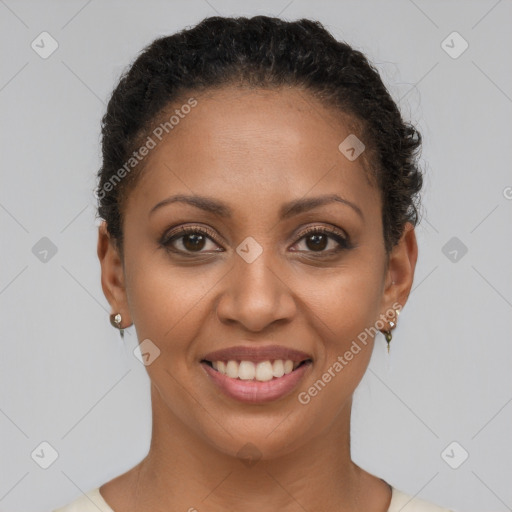 Joyful black young-adult female with short  brown hair and brown eyes