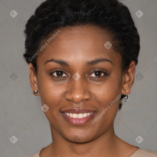 Joyful black young-adult female with short  black hair and brown eyes